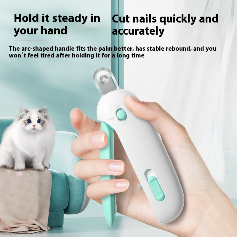 Pet nail trimmer being held by a hand with a cat in the background, on a light blue surface.