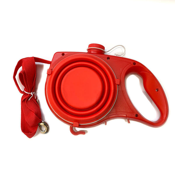 Red retractable dog leash and collar on a white background
