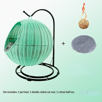 Green woven pet bed with stand, rattan ball toy, and purple mat on a light green background.