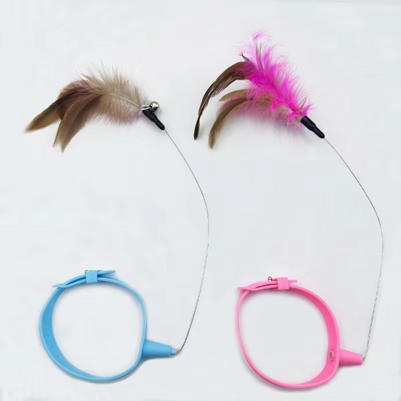 Two cat toys with feathers on strings, one blue and one pink, on a white background.