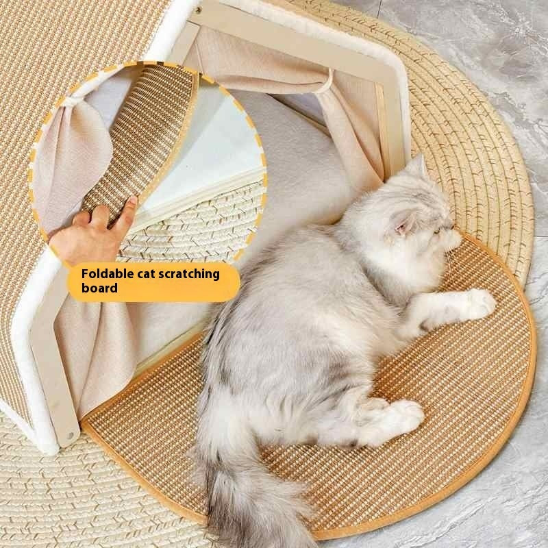 Cat lying on a round, beige cat scratching board with a hand holding a folded mat above it.