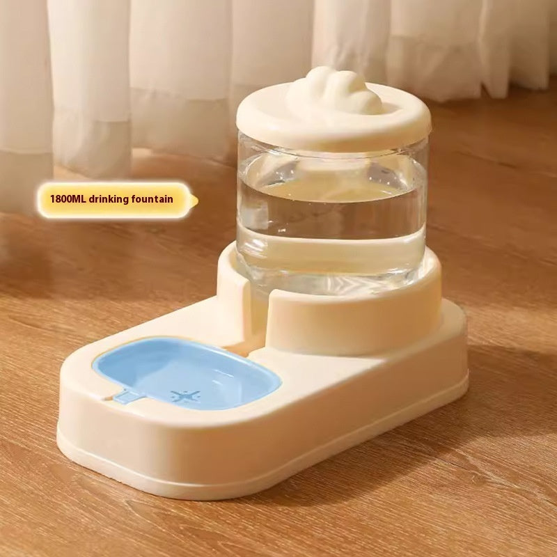 Pet drinking fountain with water bowl on a wooden floor
