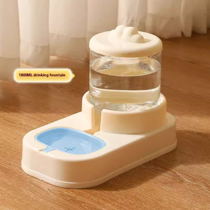 Pet drinking fountain with water bowl on a wooden floor