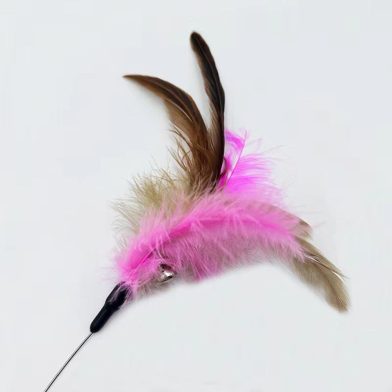 Cat toy with pink feathers and a black base on a white background