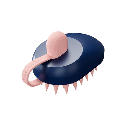 Navy blue and pink grooming tool with spiked design on a white background