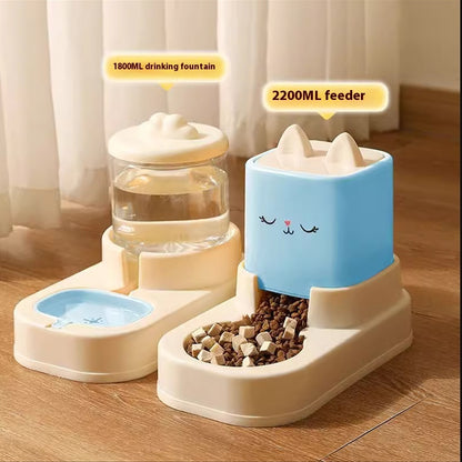 Pet drinking fountain and feeder set on a wooden floor with curtains in the background.