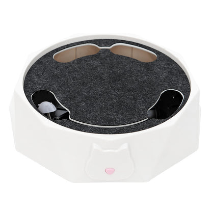 White electronic device with a dark gray circular component on a white background