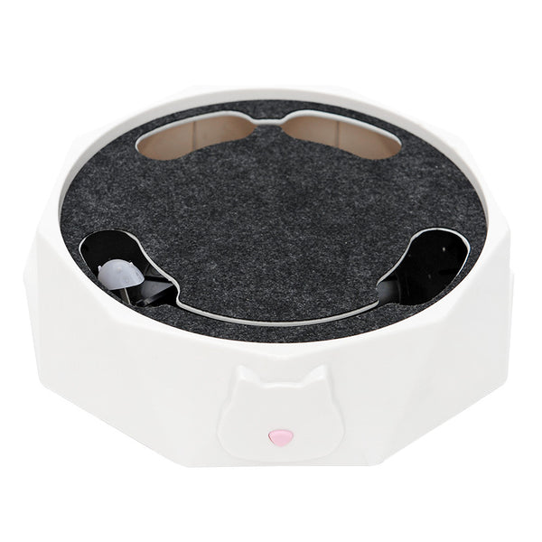 White electronic device with a dark gray circular component on a white background