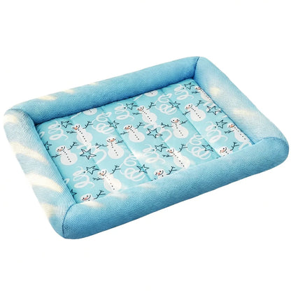 Blue pet bed with snowman pattern on a white background