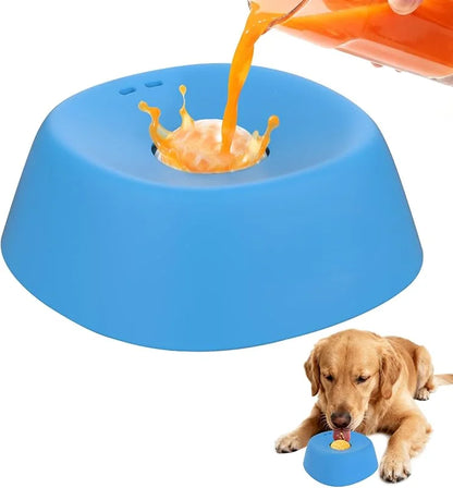 Blue pet toy with orange liquid being poured into it, next to a dog.