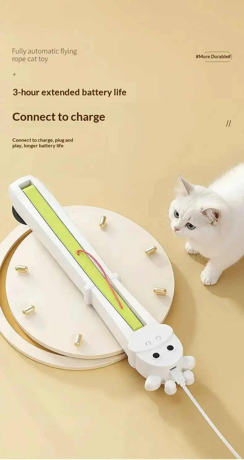 A white automatic flying rope cat toy with a cartoon octopus tail is shown on a round wooden perch next to a white cat, with promotional text on a beige background.