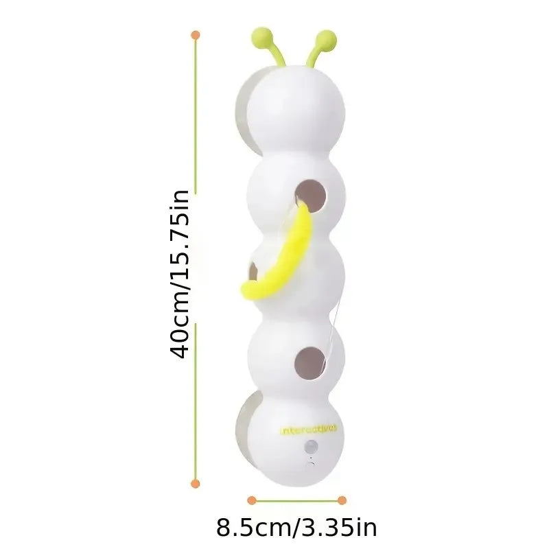 White toy with green antennae and yellow accents, showing dimensions on a white background