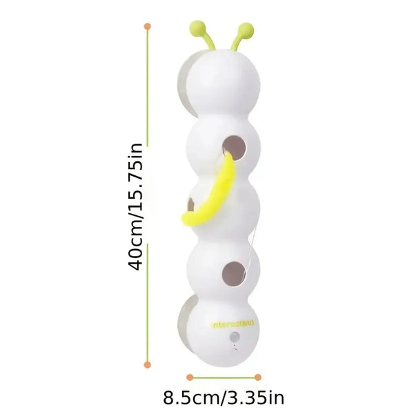 White toy with green antennae and yellow accents, showing dimensions on a white background