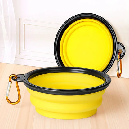 Yellow collapsible silicone travel bowl for dogs open and filled