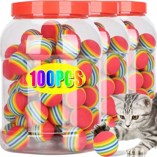 Jar of colorful striped balls with a cat playing with one, labeled '100pcs'.