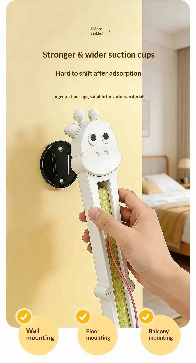 Hand holding a white tool with cartoon design against a beige wall, with text about suction cup features.