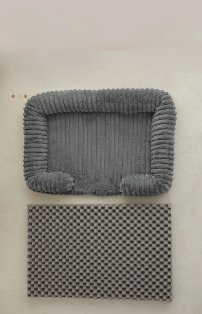 Gray textured pet bed on a beige background