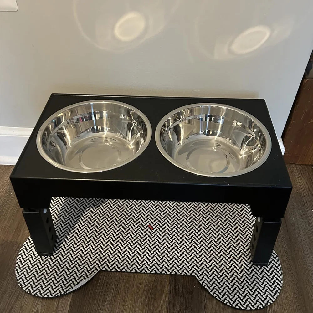 Adjustable elevated dog feeder with double bowls placed on pet feeding mat