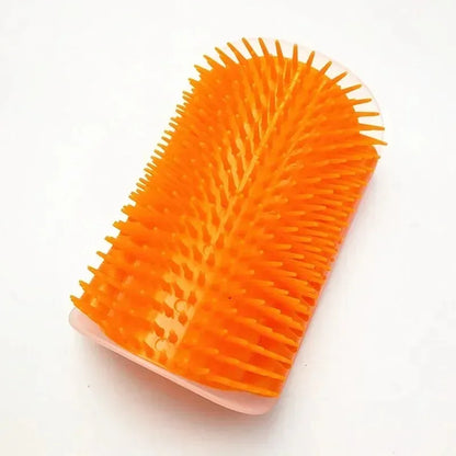 Orange pet grooming brush on a white background