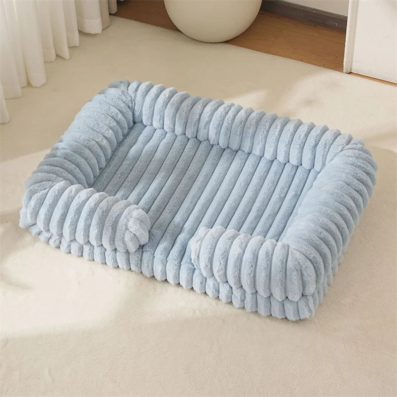 Light blue pet bed on a beige carpet