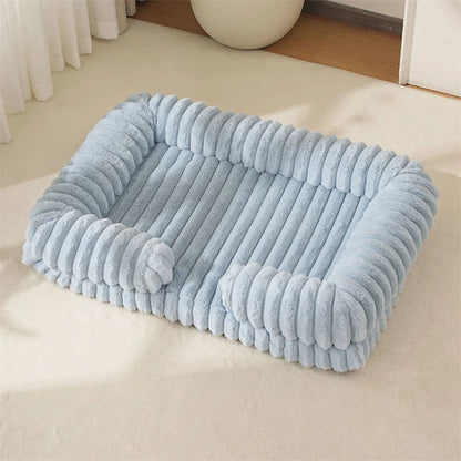 Light blue pet bed on a beige carpet