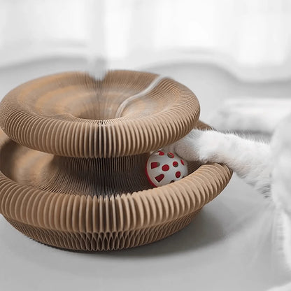 Cat toy with a ball inside on a white surface