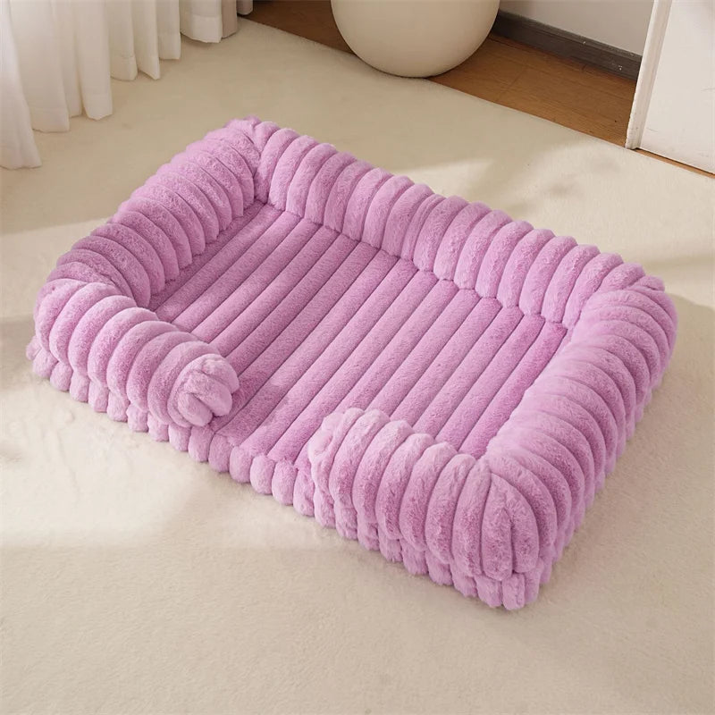 Pink pet bed on a light-colored floor