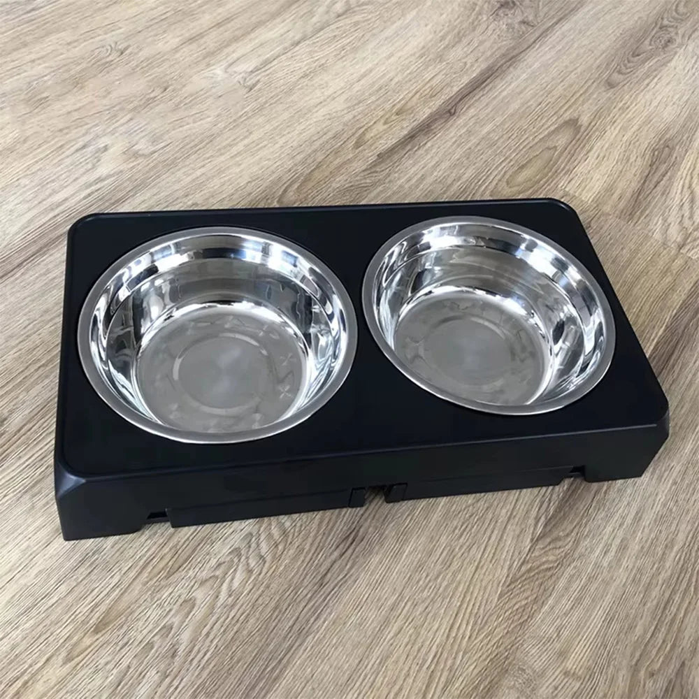 Double stainless steel dog bowls on black elevated feeder stand for home use