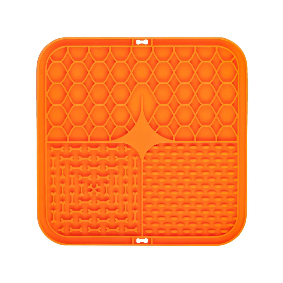 Orange silicone mat with textured surface on a white background