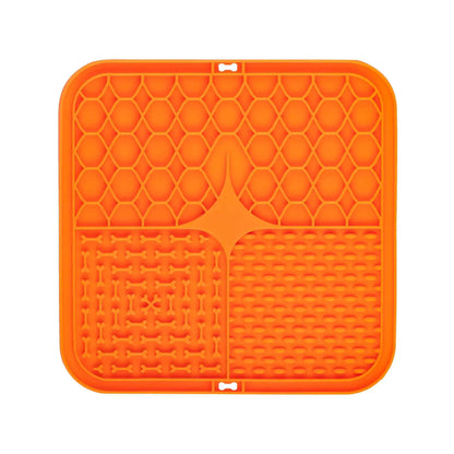 Orange silicone mat with textured surface on a white background