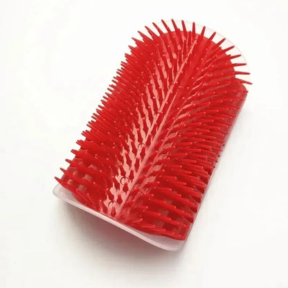 Red grooming brush on a white background