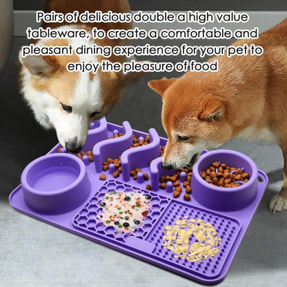 Two dogs eating from a purple pet feeding mat with multiple compartments.