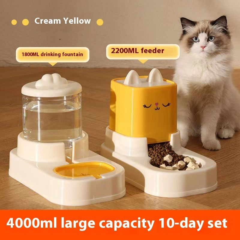 Pet feeding and drinking station with a cat sitting next to it on a wooden floor.