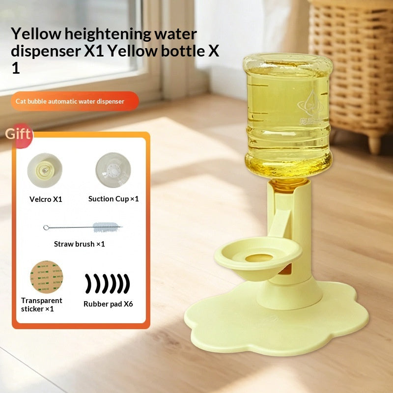 Yellow automatic water dispenser bottle holder with a flower-shaped base, shown on a wooden floor in a bright room. The image includes a product inset showing included accessories like a straws brush, suction cup, and transparent sticker.