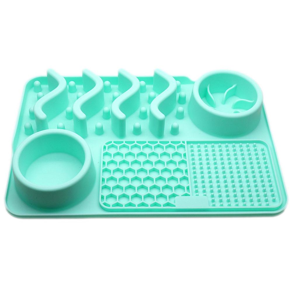 Turquoise silicone mat with two bowls on a white background