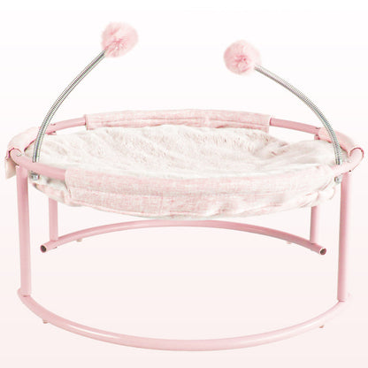 Pink pet hammock with fluffy cushion and pom-poms on a white background
