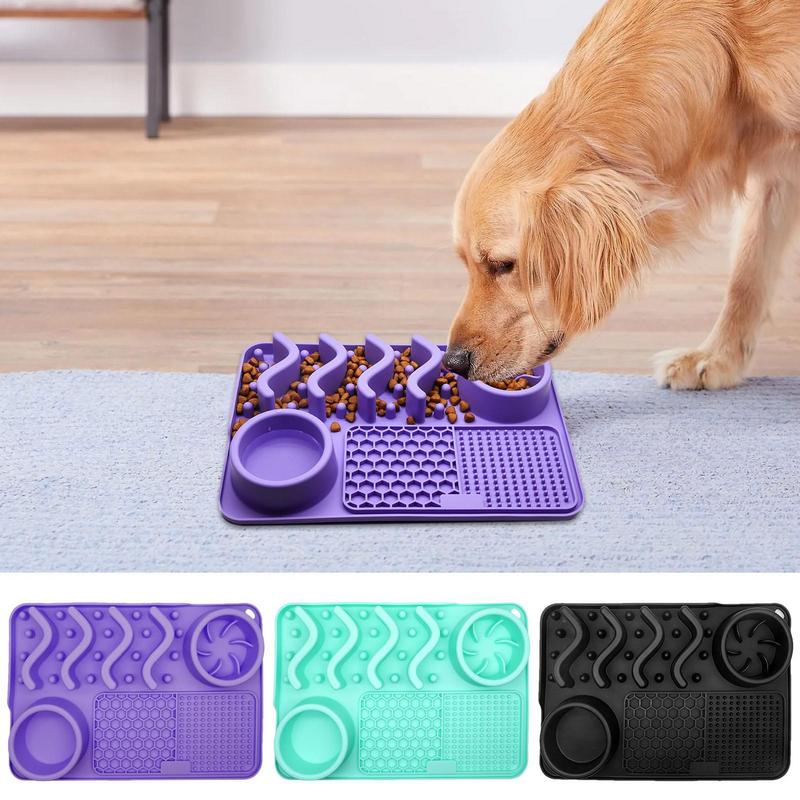 Dog eating from a purple pet slow feeder mat on a wooden floor.